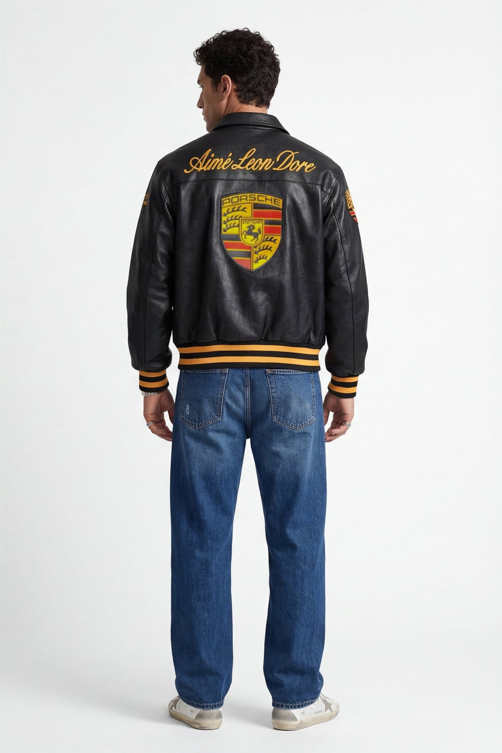 Black Porsche varsity jacket with Aime Leon Dore branding, yellow stripes, from revnhaus