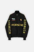 Black Porsche racing jacket with yellow lettering and team logos from revnhaus