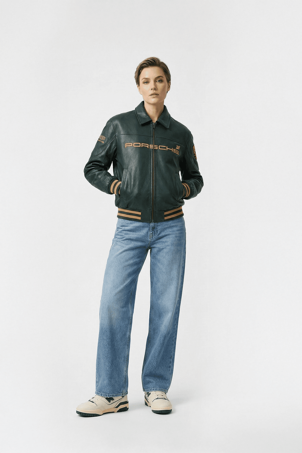Women's Porsche racing leather jacket with gold lettering and stripes, styled with jeans from revnhaus