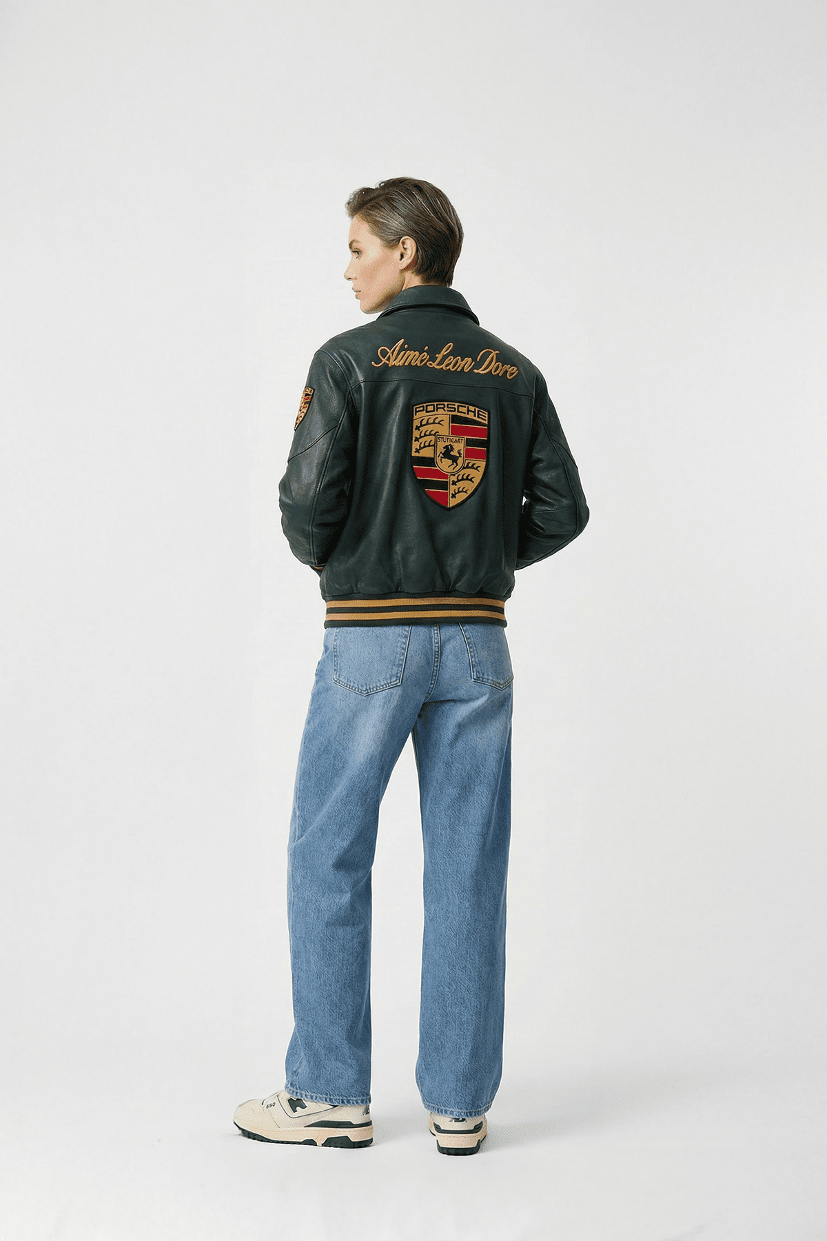 Black Porsche varsity jacket with embroidered crest and Aime Leon Dore logo, from revnhaus