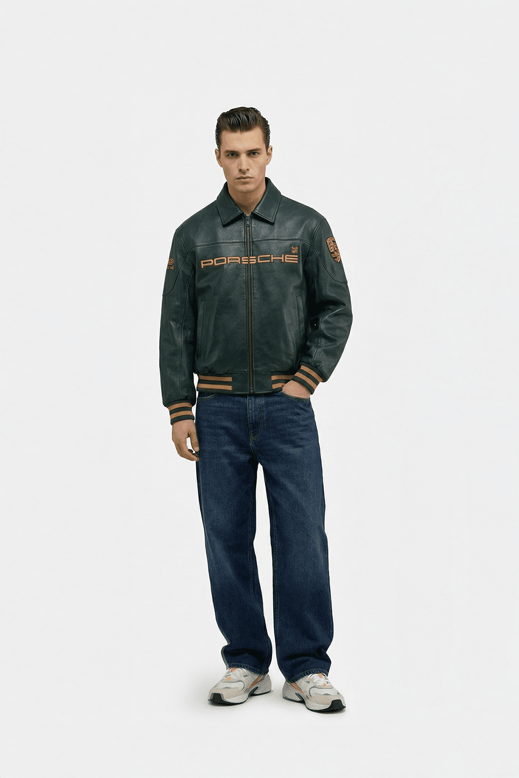 Men's Porsche leather racing jacket with embroidered logo, styled with jeans and sneakers from revnhaus