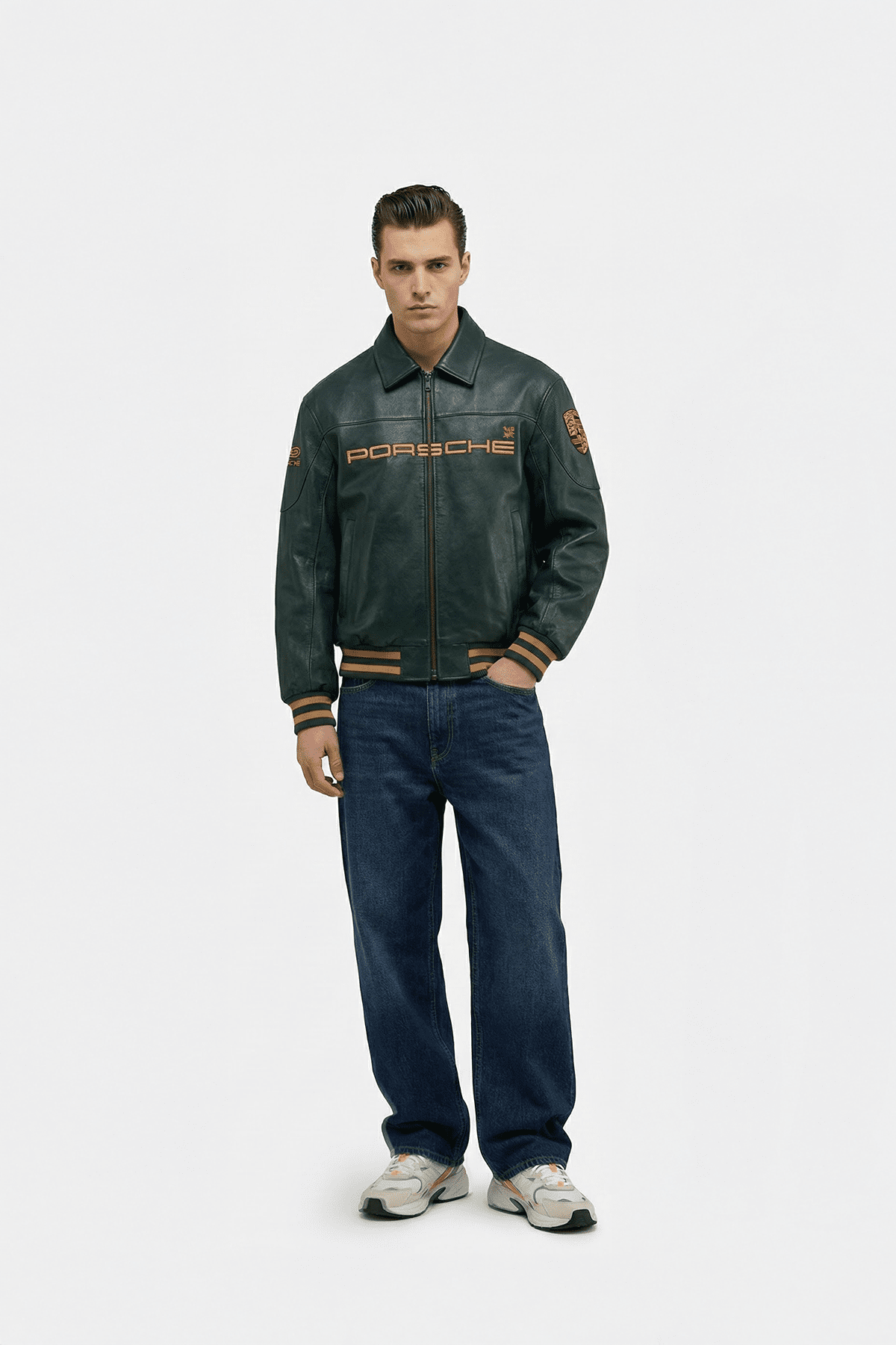 Men's Porsche leather racing jacket with embroidered logo, styled with jeans and sneakers from revnhaus