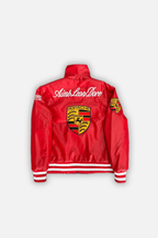 Red Porsche racing jacket with Aime Leon Dore logo and crest, motorsport apparel from revnhaus