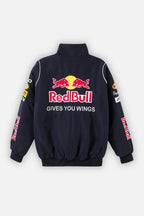 Red Bull racing jacket with logo and 'GIVES YOU WINGS' text, motorsport apparel from revnhaus