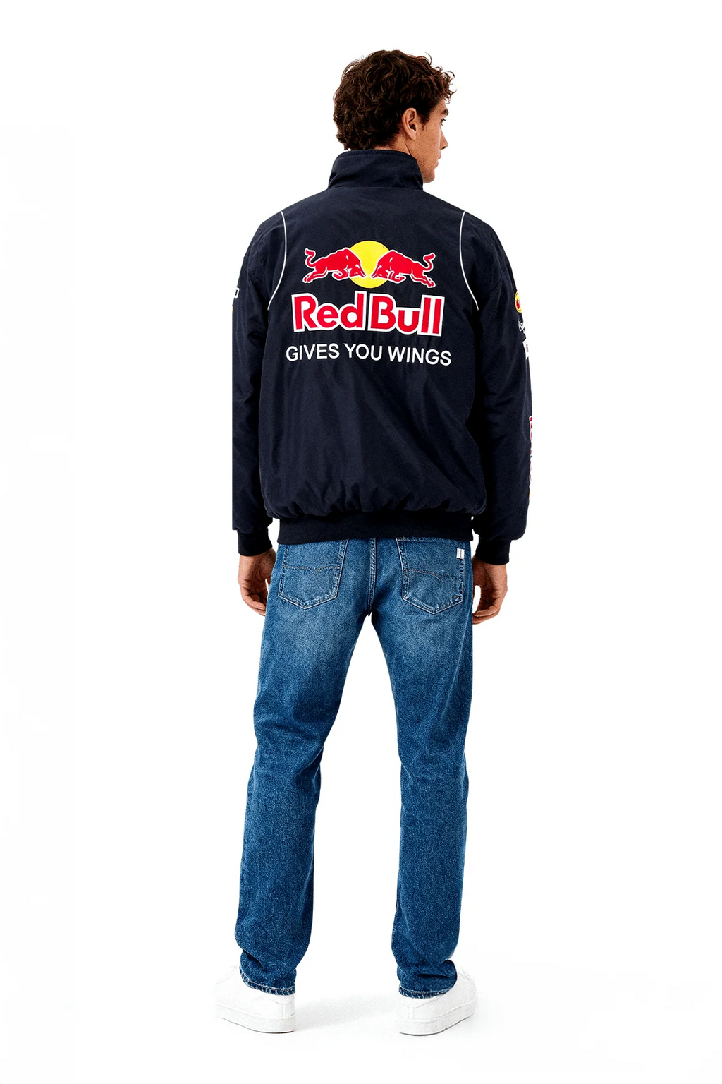 Red Bull racing jacket with 'Gives You Wings' logo on back, worn with jeans from revnhaus