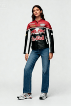 Red Bull racing jacket with Motul and Michelin logos, worn with jeans and sneakers from revnhaus