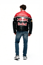 Red Bull racing leather jacket with bold logo, worn by man in jeans, from revnhaus