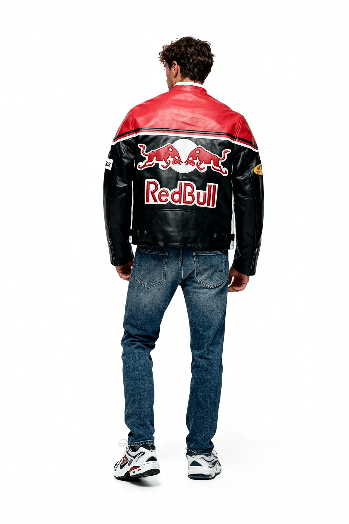 Red Bull racing leather jacket with bold logo, worn by man in jeans, from revnhaus