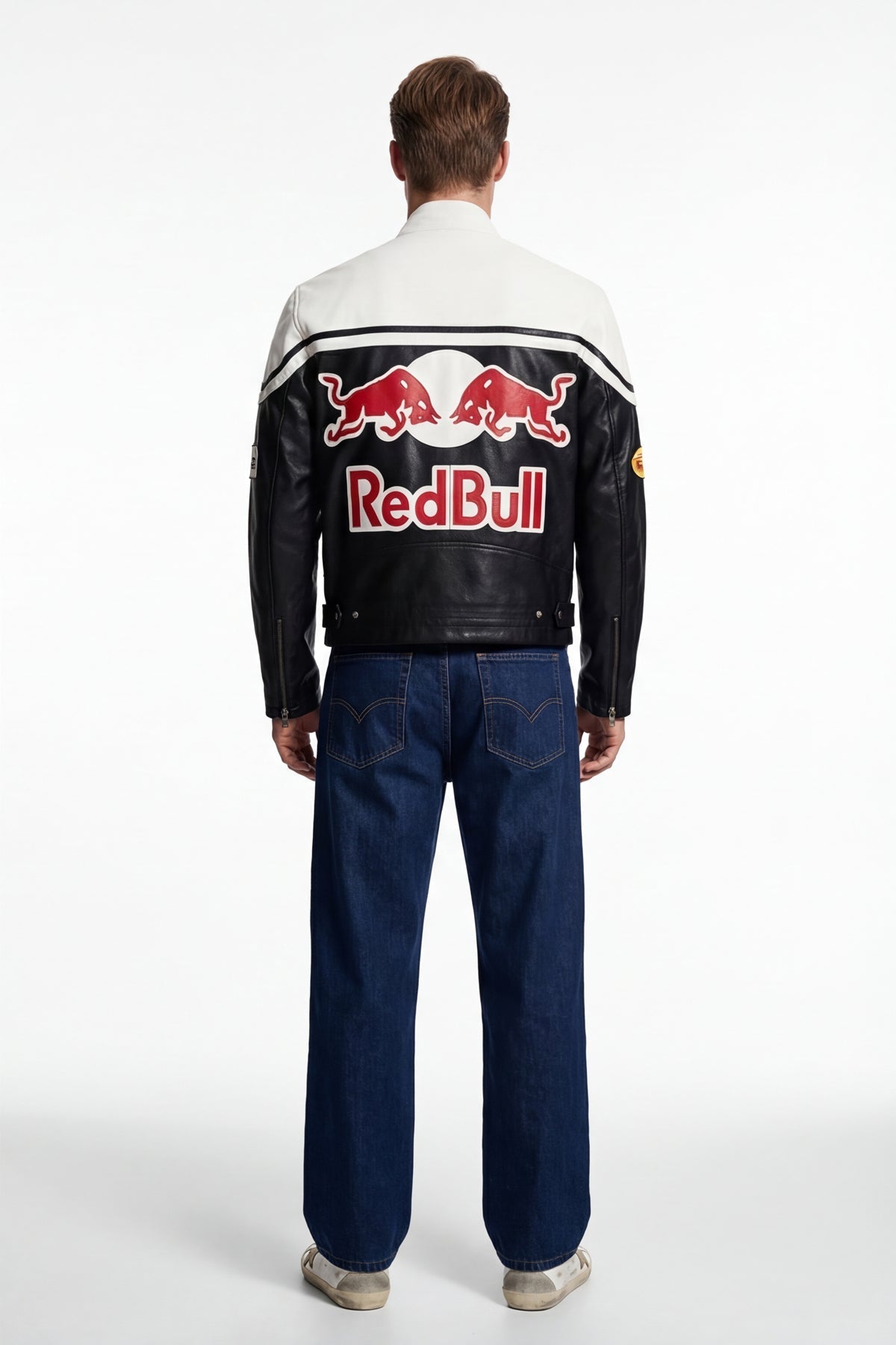 Red Bull racing leather jacket with bold logo, worn by model in jeans, from revnhaus