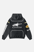 Black Alpinestars racing hoodie with sponsor logos, motorsport style from revnhaus