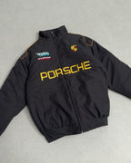 Black Porsche motorsport jacket with yellow logo and Team TOYO patch from revnhaus