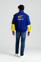 Blue and yellow Subaru World Rally Team jacket with logo on back from revnhaus