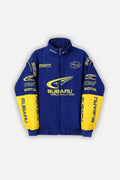 Blue and yellow Subaru World Rally Team racing jacket with Pirelli, Motul, STI logos from revnhaus