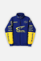 Blue and yellow Subaru World Rally Team racing jacket with Pirelli, Motul, STI logos from revnhaus