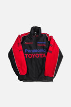 Panasonic Toyota F1 racing jacket with red black design and Bridgestone logo from revnhaus