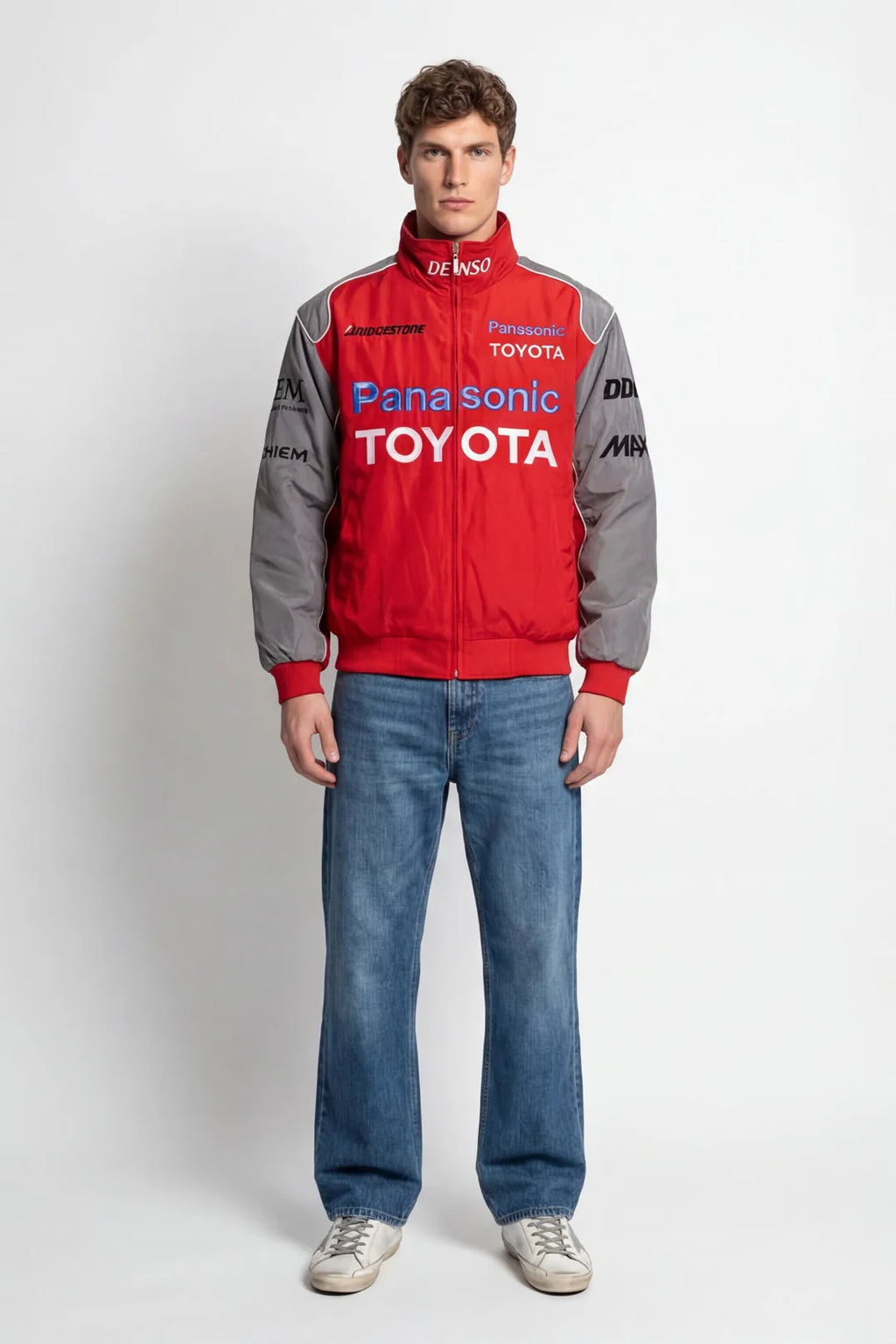 Red and gray Panasonic Toyota racing jacket with sponsor logos, worn with blue jeans from revnhaus