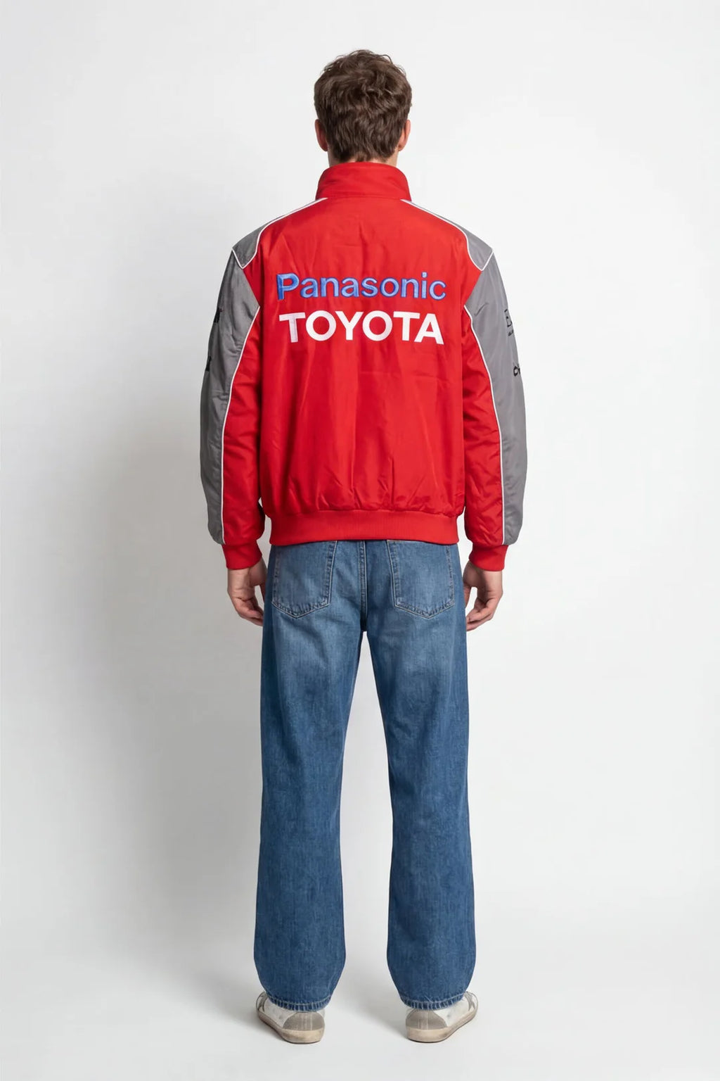Red and gray Panasonic Toyota racing jacket worn with blue jeans from revnhaus