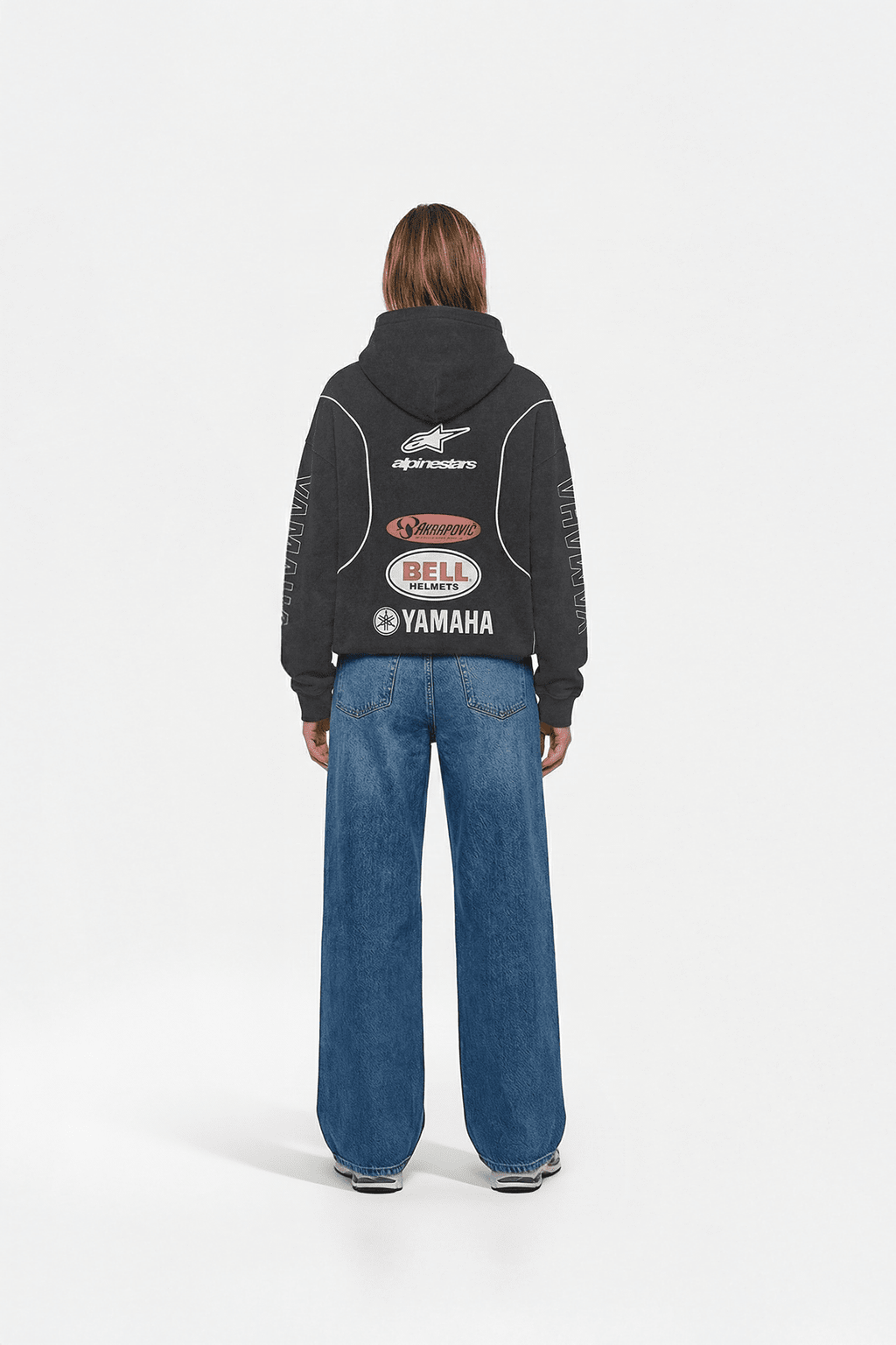 Black motorsport hoodie with Alpinestars, Akrapovic, Bell Helmets, Yamaha logos from revnhaus