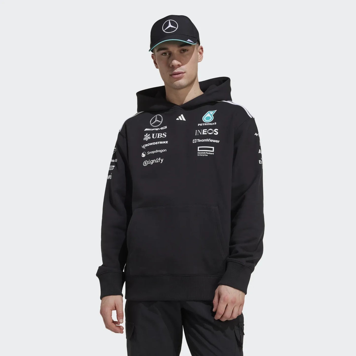 Black Mercedes-AMG F1 team hoodie with sponsor logos and cap, motorsport apparel from revnhaus